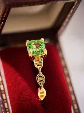 Golden Ring with Vibrant Green Gemstone